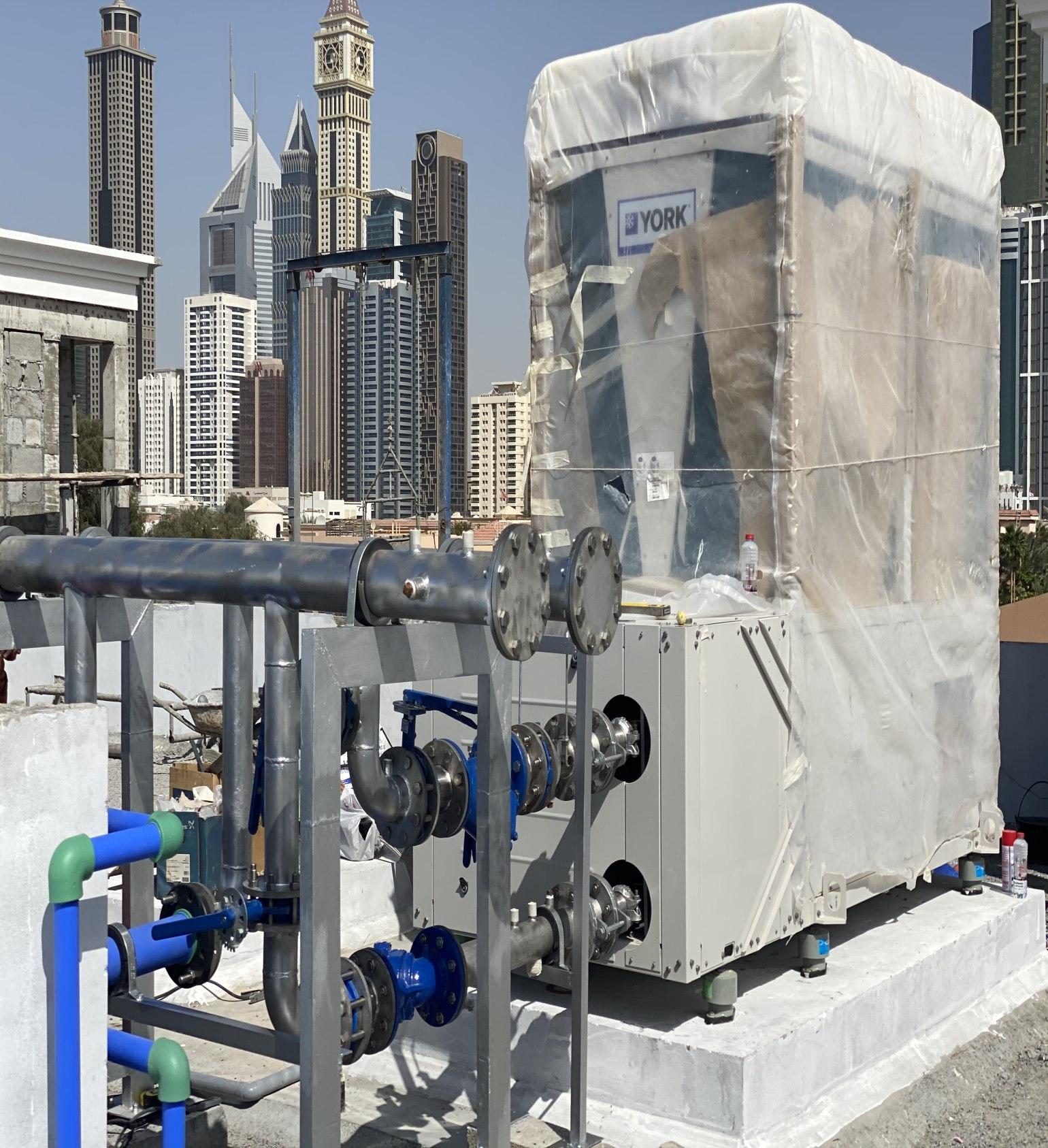 HVAC chiller installation with Dubai skyline — Cool Air Electromechanical